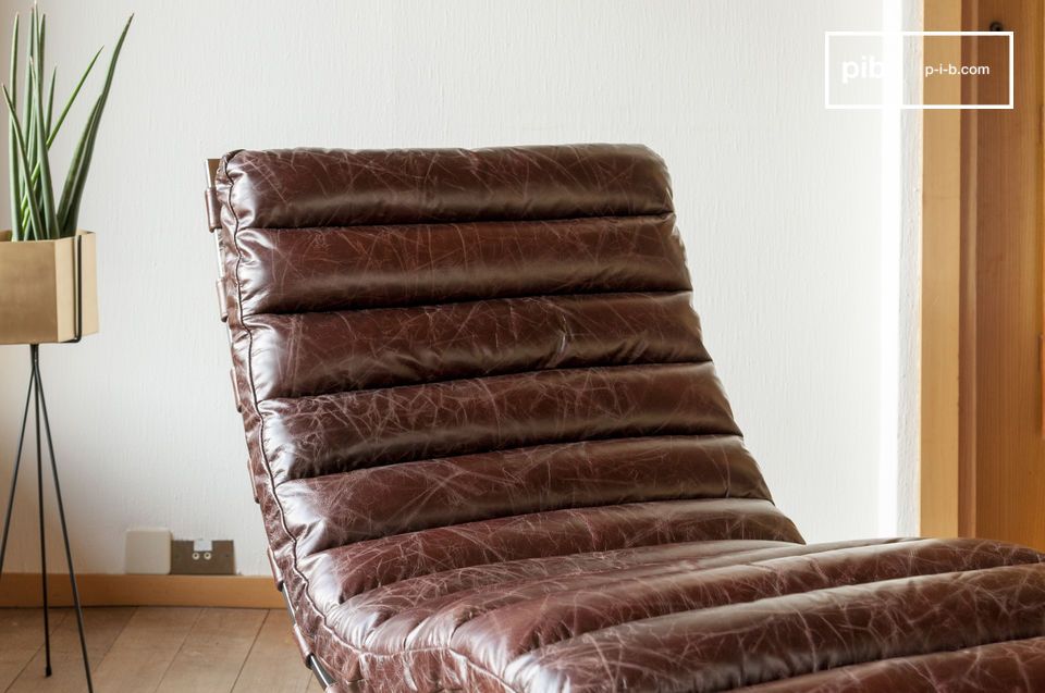 Esta silla de descanso original y de diseño ergonómico tiene una estética refinada que hace que